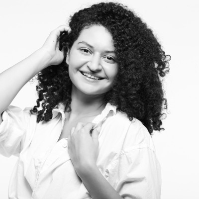 A image of a concrete sphere, balanced between two other larger spheres