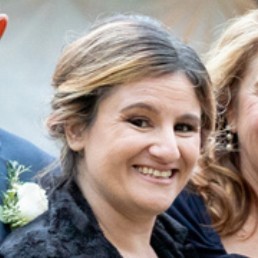 A image of a concrete sphere, balanced between two other larger spheres